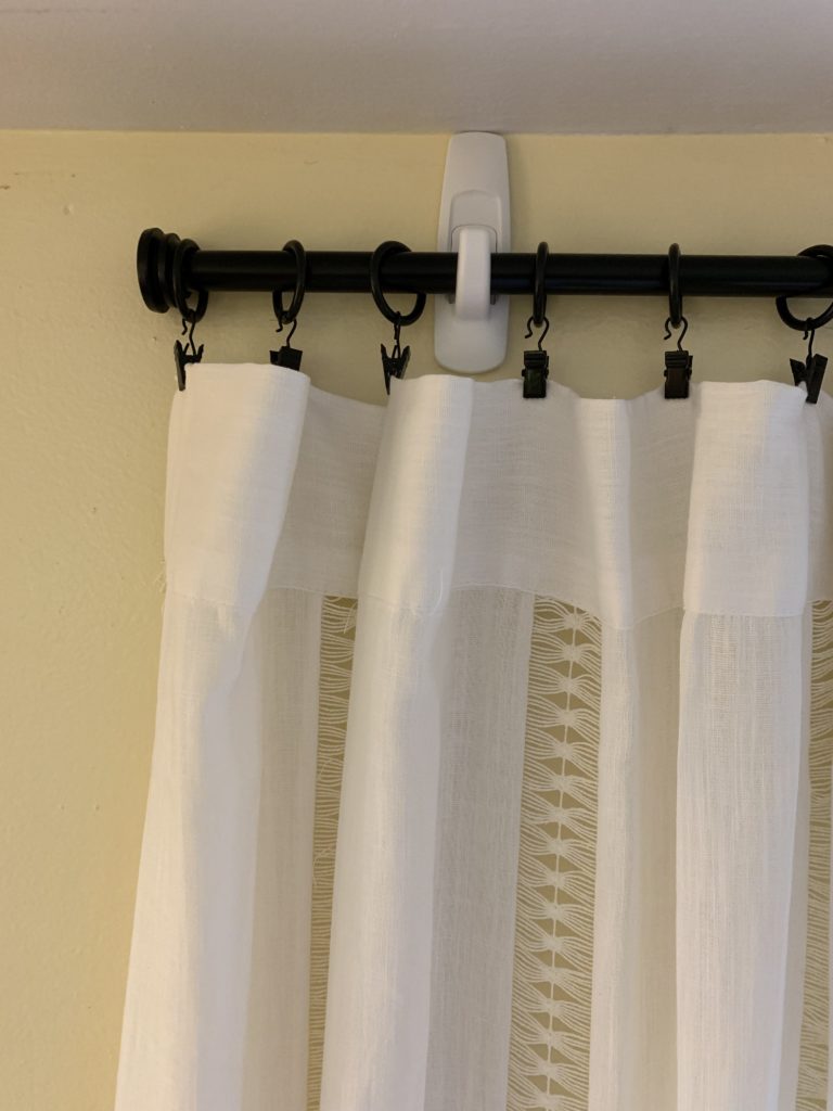 target boho curtain panel hung from black cafe rod attached with 3m command hooks