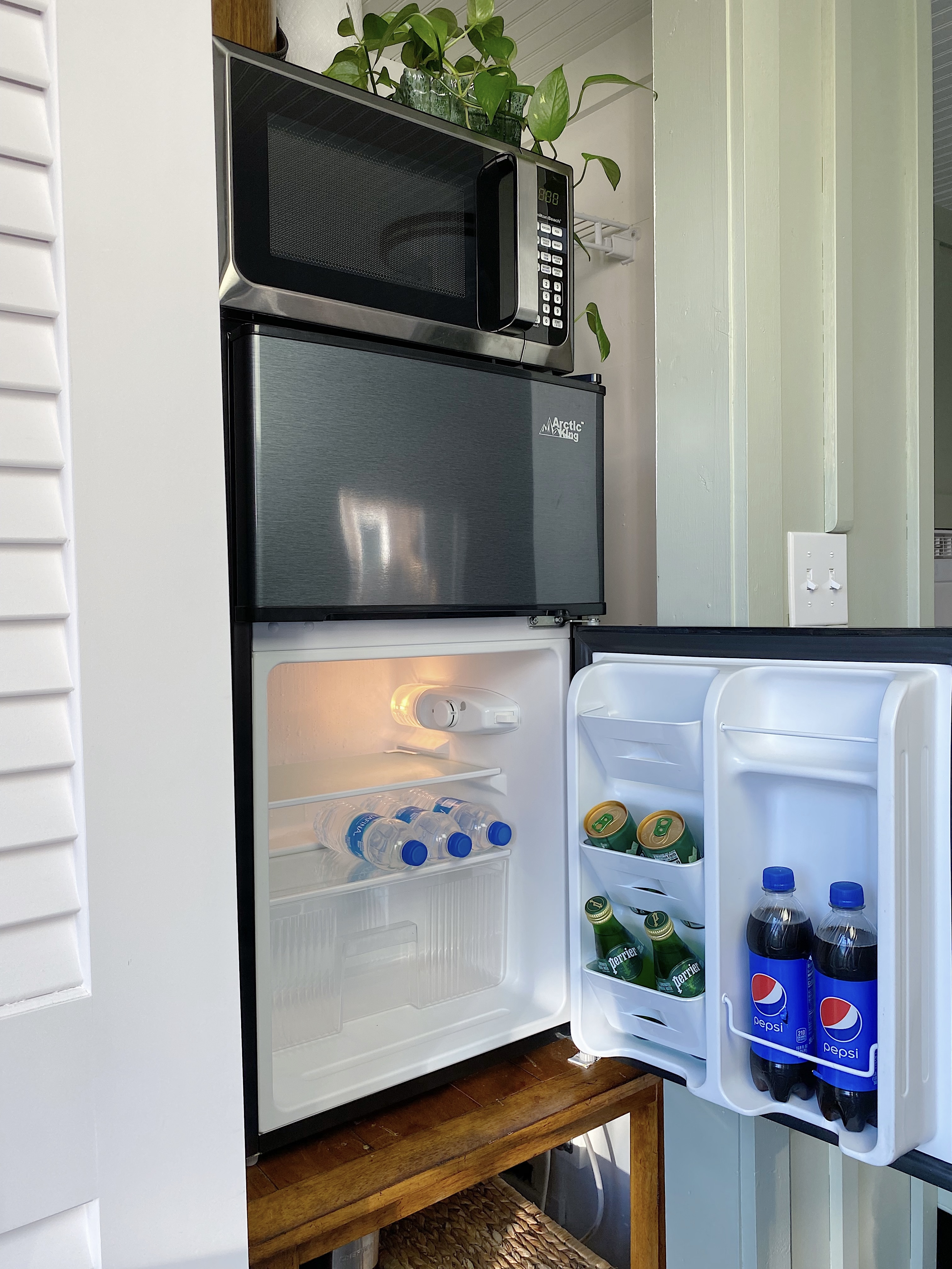 mini fridge in a closet