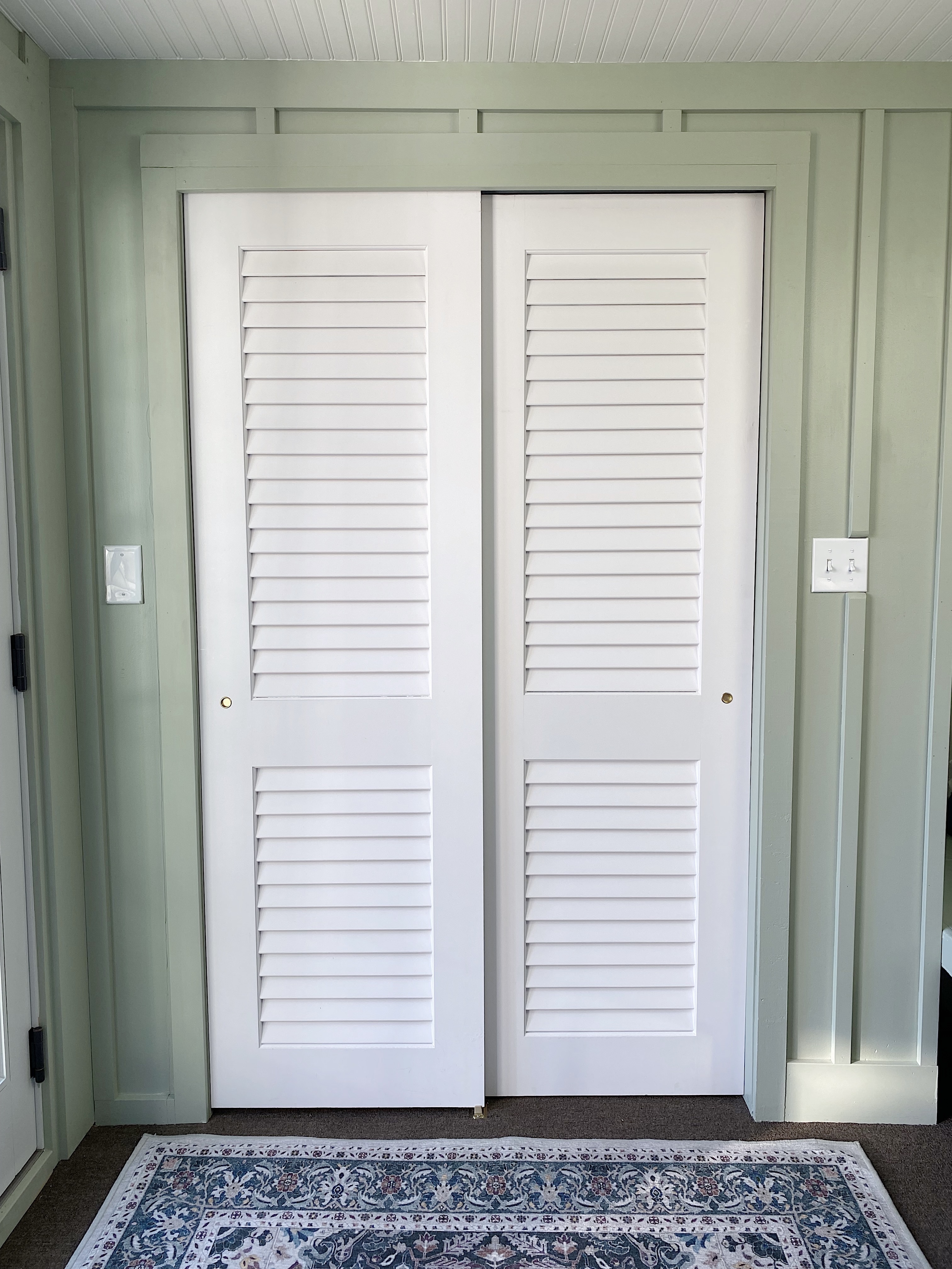 closed white louvered closet doors