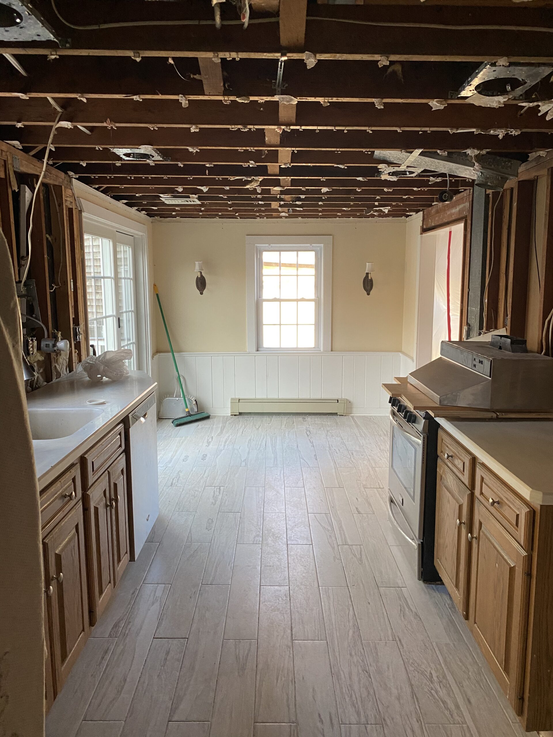 ceiling rafters exposed in galley kitchen renovation