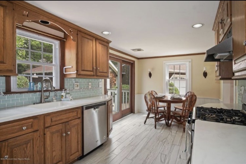 dated galley kitchen with oak cabinets